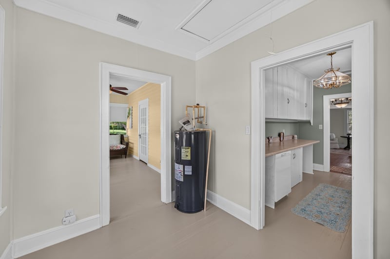 Hallway with water heater at 101 N Lake St, Crescent City, FL