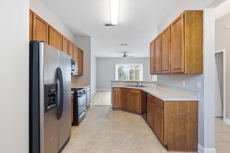 Kitchen with stainless refrigerator and gas range at 14187 Big Spring St, Jacksonville, FL 32258