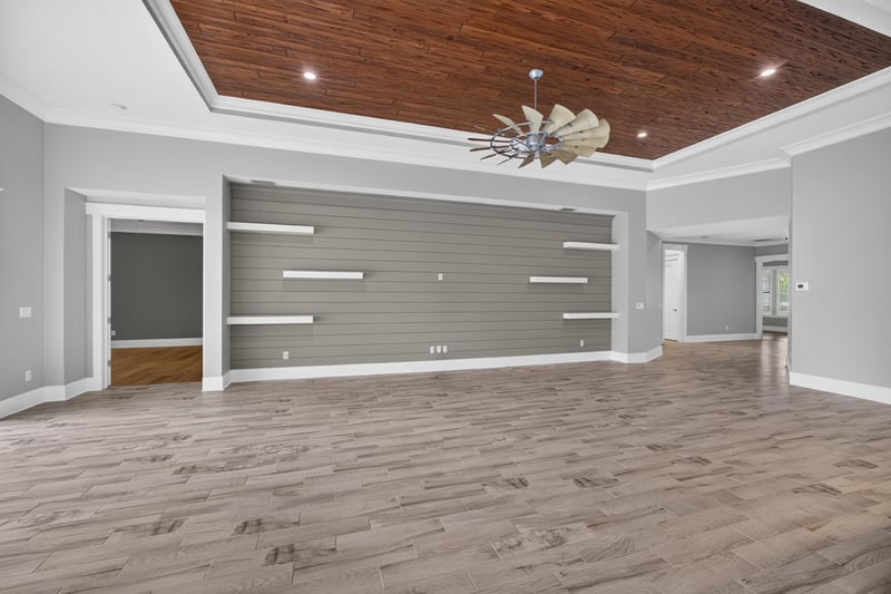 Great room wall with decorative windmill accent at 186 Freshwater Dr