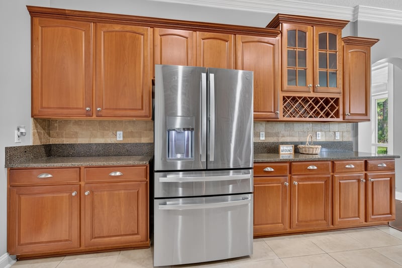 Kitchen with stainless refrigerator and wood cabinets at 4109 Eagle Landing Pkwy, Orange Park, FL 32065