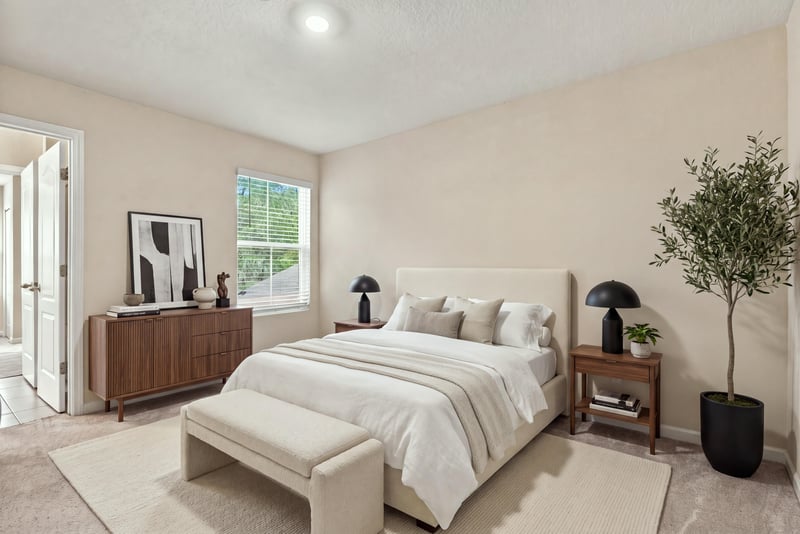 Staged bedroom with bed and nightstands at 9555 Star Dr, Jacksonville, FL 32256