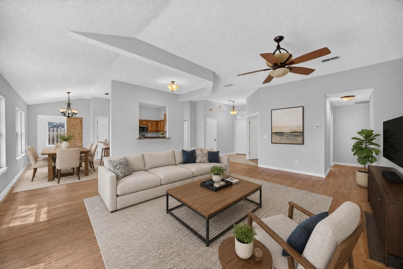 Living and dining area with vaulted ceiling and wood floors at 456 Bay Point Way N, Jacksonville, FL 32259
