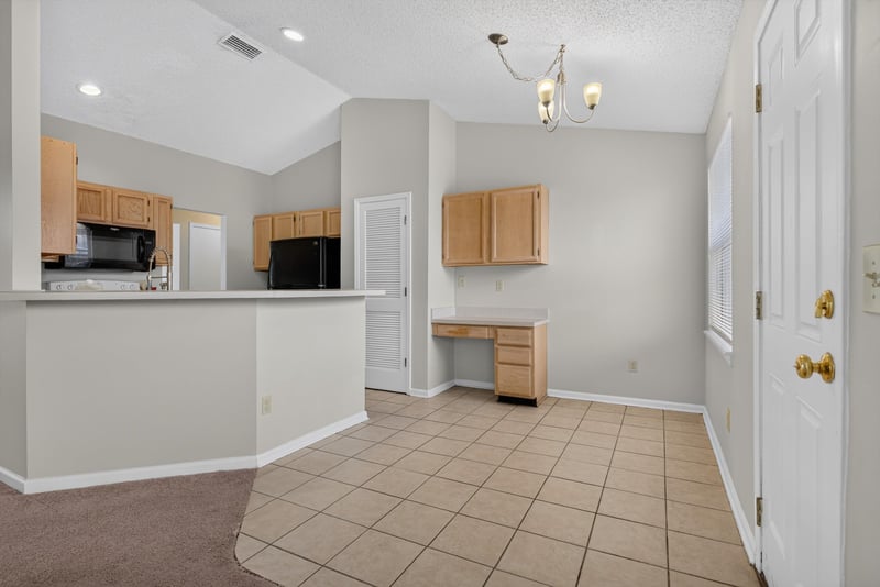Kitchen with oak cabinets and pendant light at 400 Ashcroft Landing Dr, Jacksonville, FL 32225