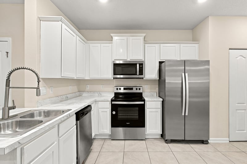 Kitchen sink and range with stainless steel finishes at 9555 Star Dr, Jacksonville, FL 32256