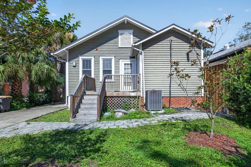 Rear porch view overlooking the back yard and trees at 1555 Belmonte Ave, Jacksonville, FL 32207