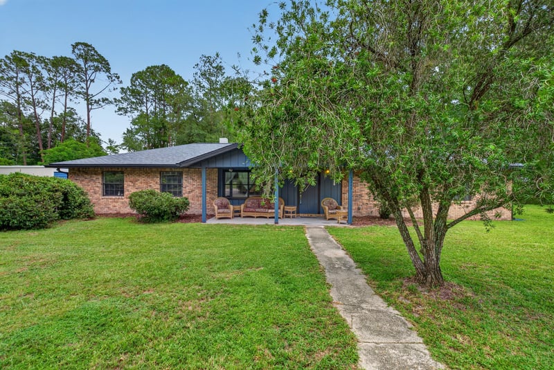 Front exterior view of brick ranch home and driveway at 3249 Maryland Ave, Green Cove Springs, FL