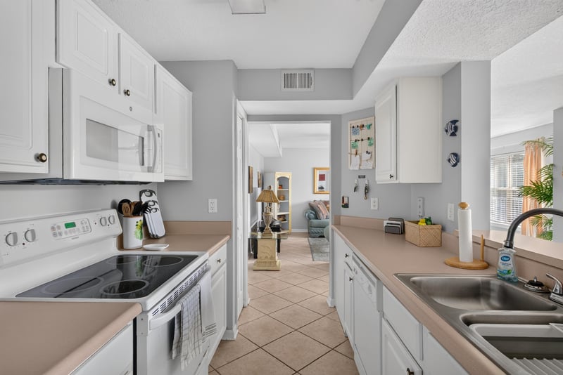 Kitchen stove and counter with hallway view beyond at 206 16th St, St. Augustine, FL 32080
