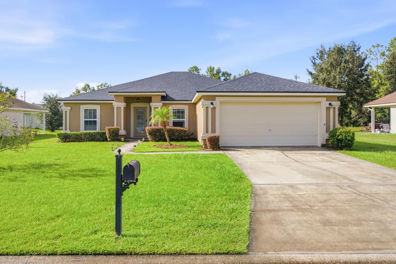 Front exterior with two-car garage and driveway at 7392 Timber Falls Ct