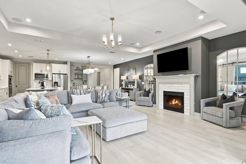 Living room with fireplace and tray ceiling at 3921 Spyglass Hill Ln