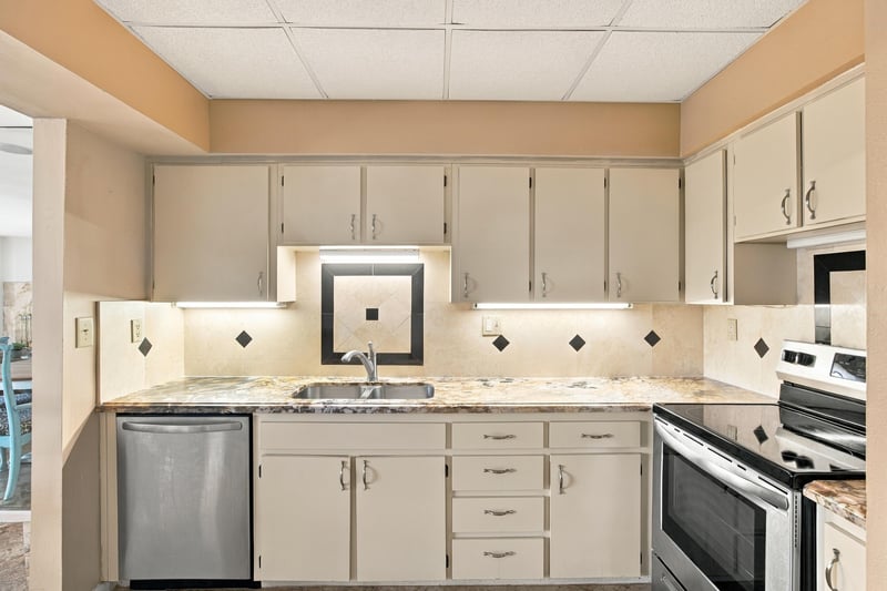 Kitchen cabinets and sink at 752 Spinnakers Reach Dr, Ponte Vedra Beach, FL 32082