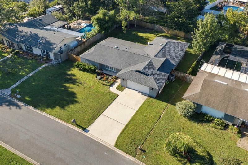 Drone aerial view of the home and neighborhood street, photographed by Megapixeler on Crosby Ln, Orange Park