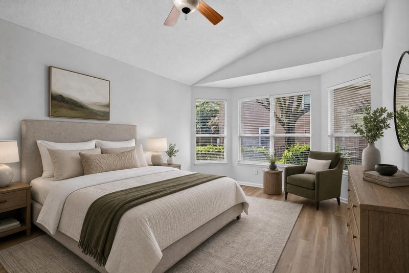 Primary bedroom virtually staged with bed and chair at 3101 E Banister Rd, St. Augustine, FL 32092