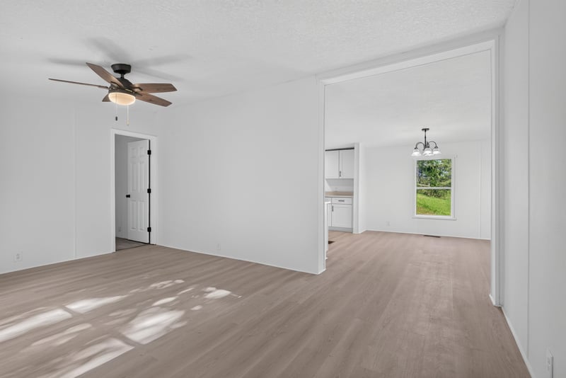 Entry hallway with wood floor and natural light at 55520 Jewel-Thomas Rd, Callahan, FL 32011
