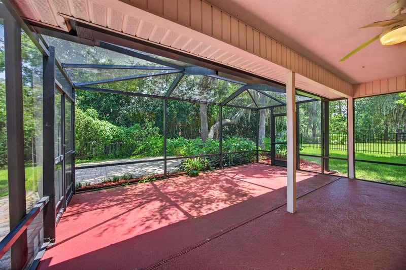 Empty screened porch with paver floor at 1955 GUARDED Way, Fleming Island, FL 32003