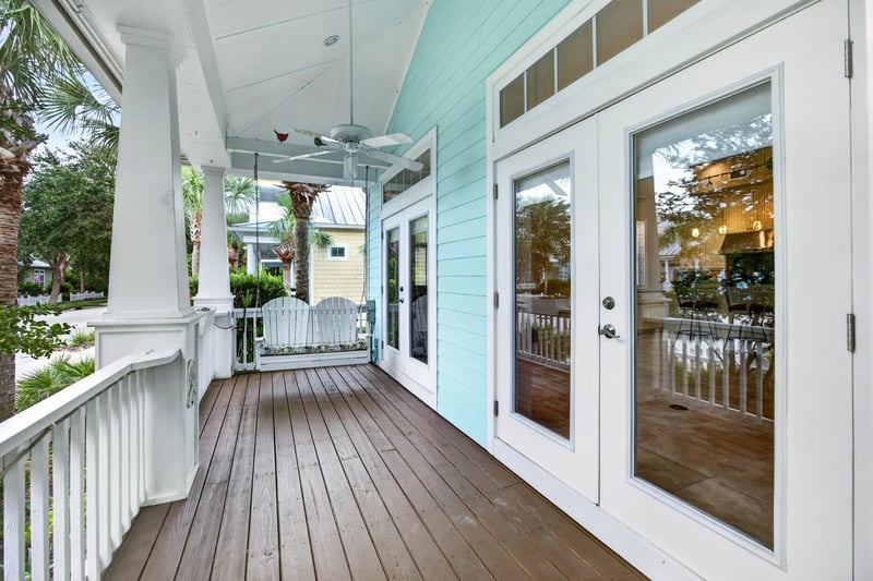 Wraparound porch with french doors and ceiling fan at 117 Island Cottage Way, St. Augustine, FL 32080