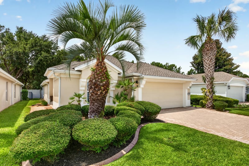 Front exterior view with landscaped shrubs at 11225 Water Spring Cir, Jacksonville, FL 32256