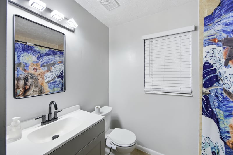 Bathroom with white vanity and toilet at 417 Capricorn Ln, Orange Park, FL 32073
