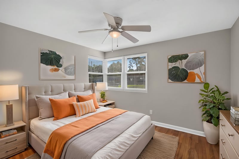 Bedroom staged with bed and nightstands at 6338 Mercer Cir W, Jacksonville, FL