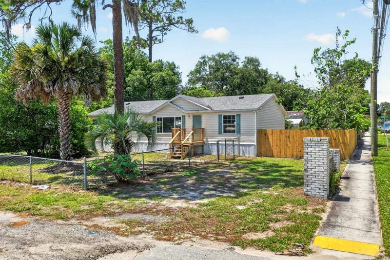 Front exterior with fence and walkway at 7603 Coach Park Dr, Jacksonville, FL 32244