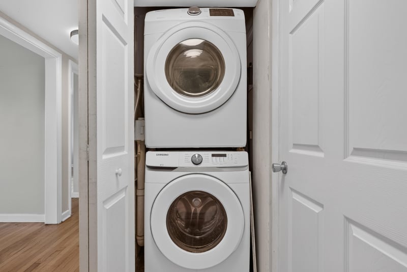 Laundry closet with stacked washer and dryer at 217 Baisden Rd, Jacksonville, FL 32218