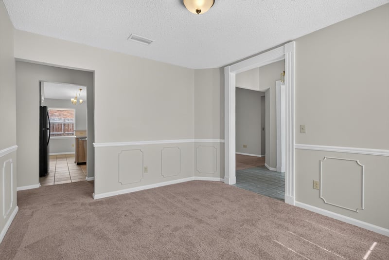 Empty room with doorways and chair-rail trim at 400 Ashcroft Landing Dr, Jacksonville, FL 32225