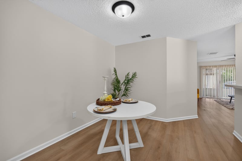 Dining area with wood-look flooring at 605 N Covered Bridge Rd, Jacksonville, FL