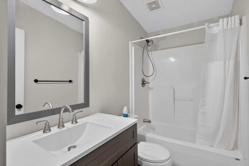 Bathroom with mirror, shower, and vanity at 4890 McAllister Rd, Middleburg, FL 32068