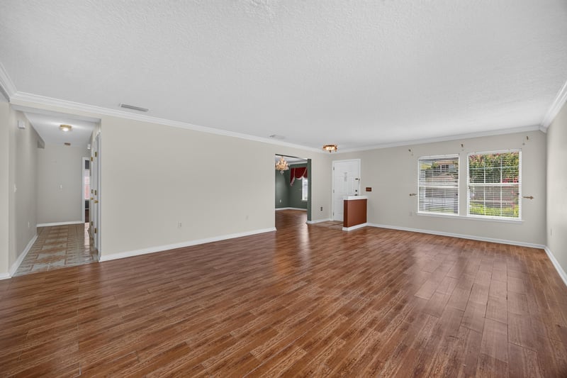 Empty family room opening to kitchen at 2282 Justin Lake Dr, Jacksonville, FL