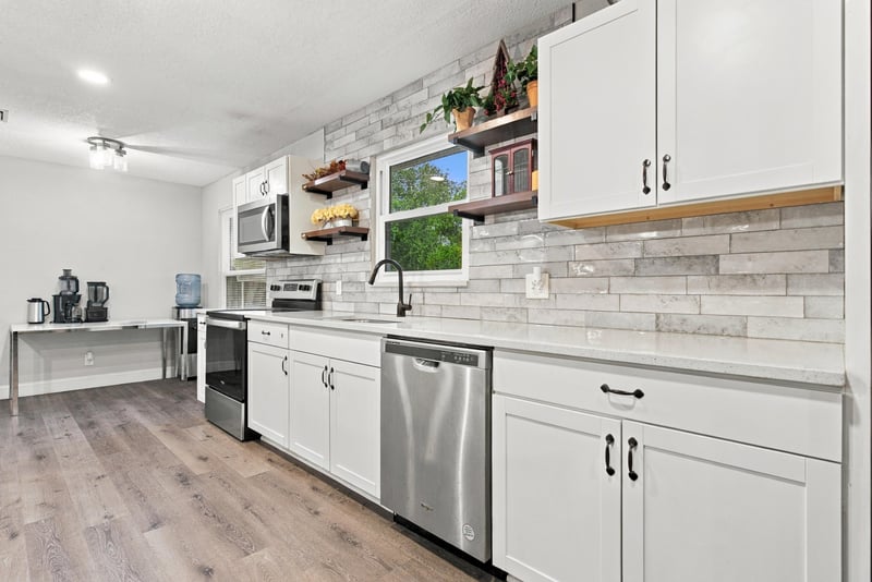 Kitchen with subway tile backsplash and dishwasher at 357 Dillon Dr, Orange Park, FL