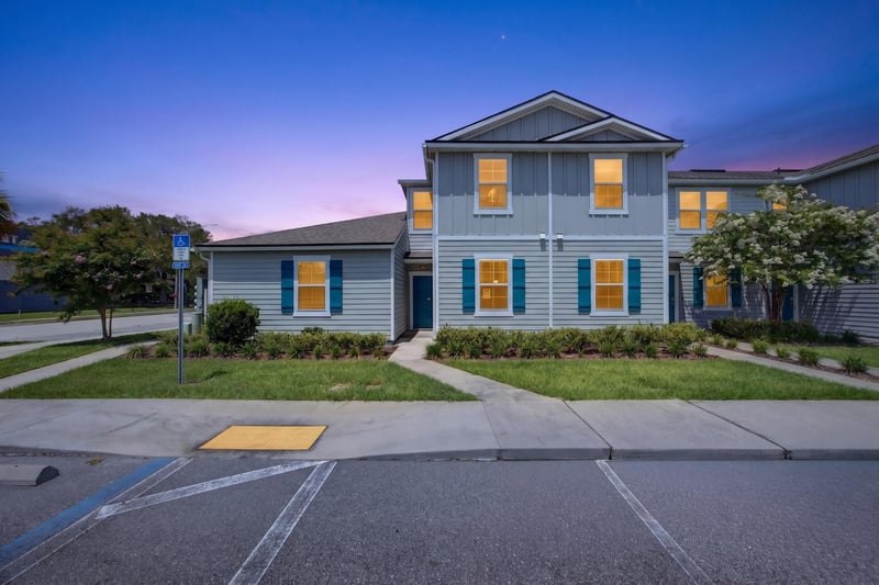 Front exterior at day-to-dusk with walkway and lawn at 2837 Black Buck Cir, Jacksonville, FL 32225