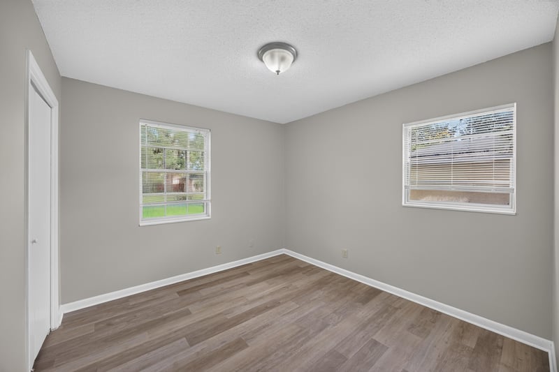 Bedroom with window and wood-look flooring at 12351 Condor Dr