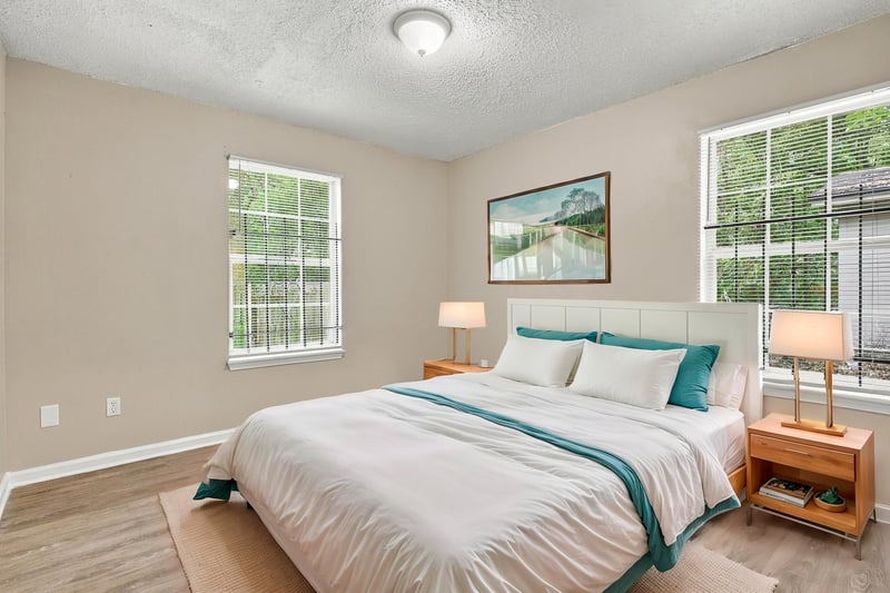 Bedroom with bed and teal bedding, staged, at 219 Shortreed St, Jacksonville, FL 32254