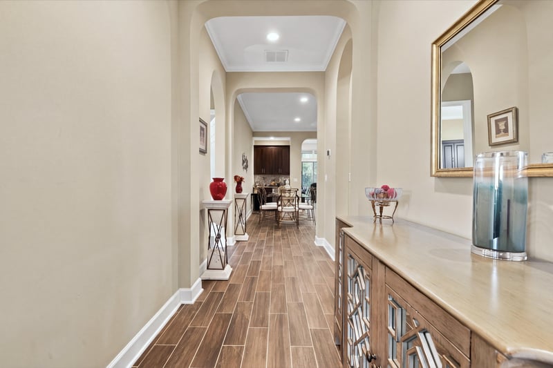 Hallway leading toward living area, photographed by Megapixeler on Lucena Ln, Jacksonville, FL