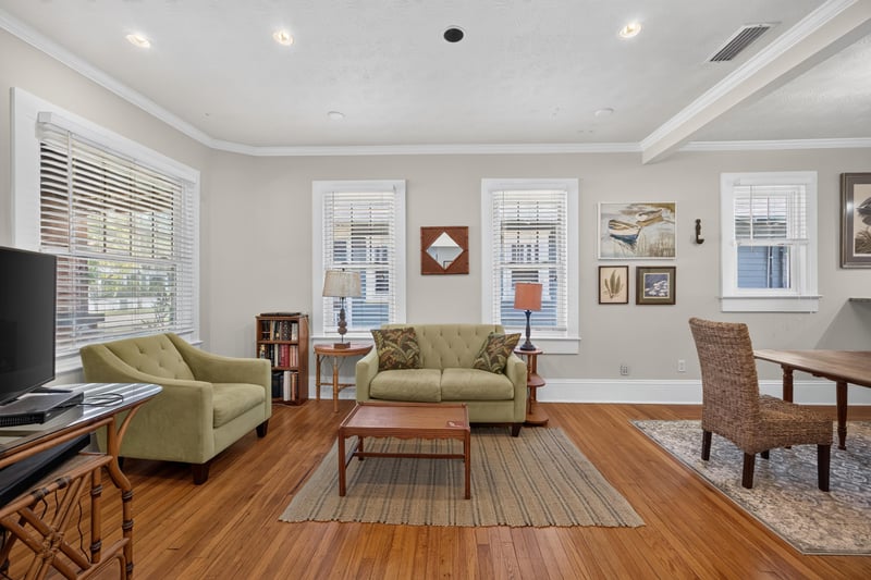 Living room with hardwood floors and built-in cabinetry at 1555 Belmonte Ave, Jacksonville, FL 32207
