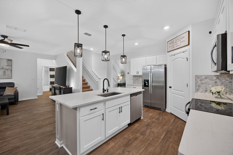 Kitchen view toward staircase and living area at 65255 Frst Glen Ln, Yulee, FL 32097