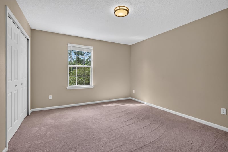 Bedroom with carpet and window at 13685 Goodson Pl, Jacksonville, FL 32226