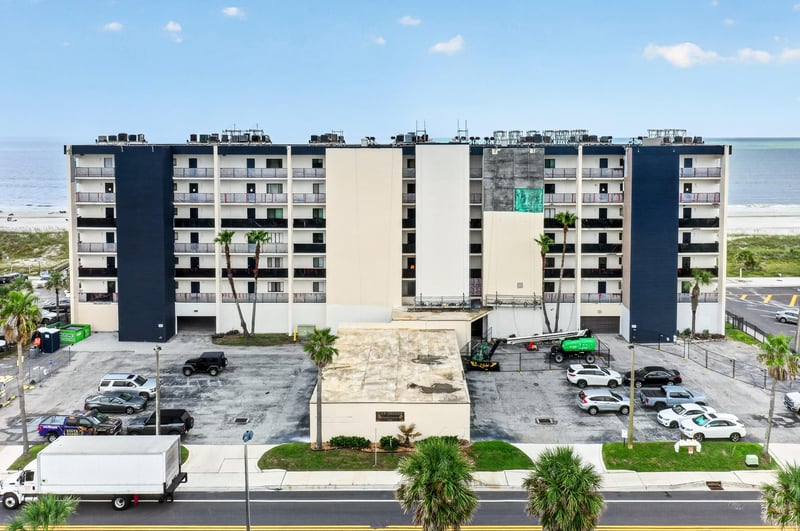 Aerial front view of the oceanfront building at 601 1st St S, Jacksonville Beach