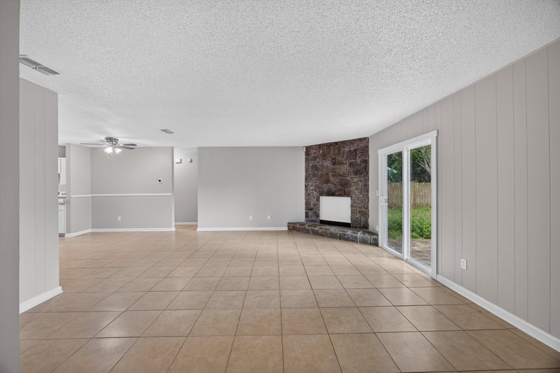 Open living and dining area with tile floor at 1040 Willow Cove Ct E, Jacksonville, FL 32233
