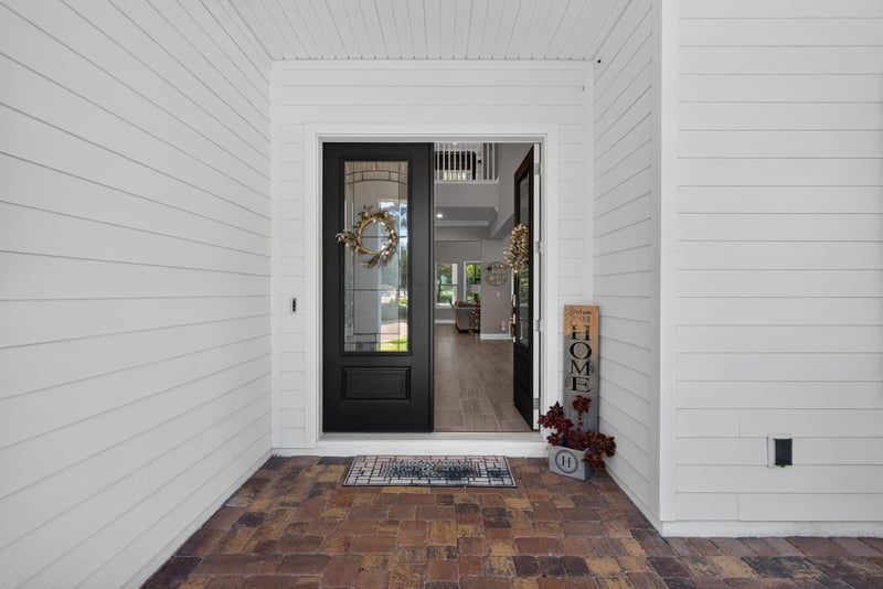 Entry hall with brick-patterned tile floor at 22 Azura Point