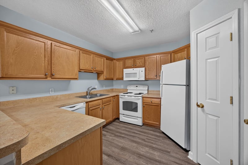 Kitchen with range and counter space at 1701 The Greens Way 1415, Jacksonville Beach, FL 32250