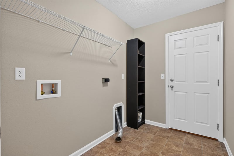 Laundry area with wire shelving at 7253 Townsend Village Ct, Jacksonville, FL