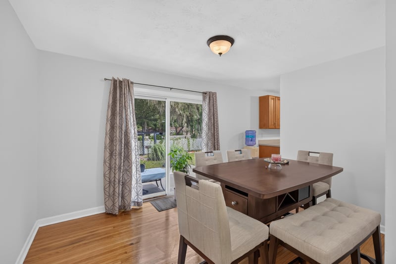 Dining area with sliding glass door and table at 1847 Grove Park Dr, Orange Park, FL