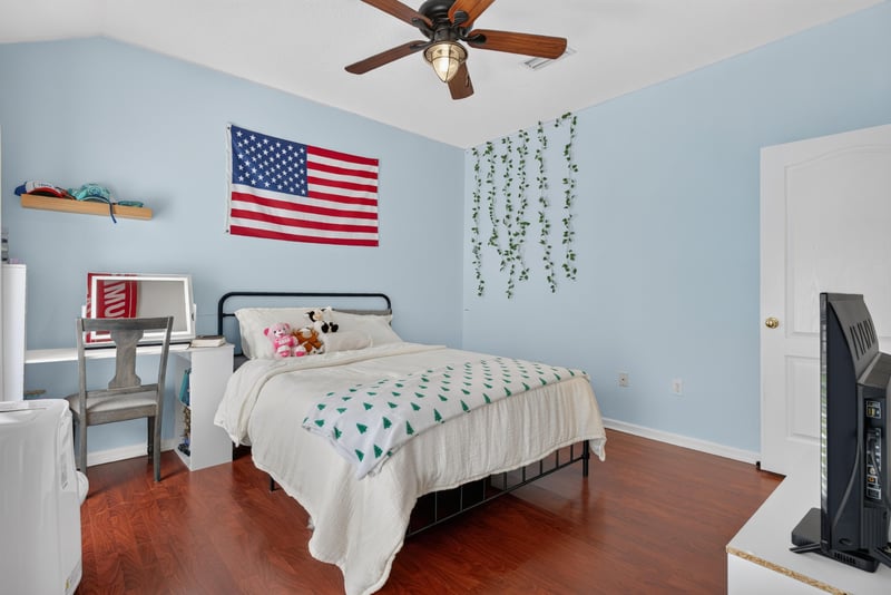 Bedroom with patriotic decor at 2304 Spring Hill Ct, Orange Park, FL