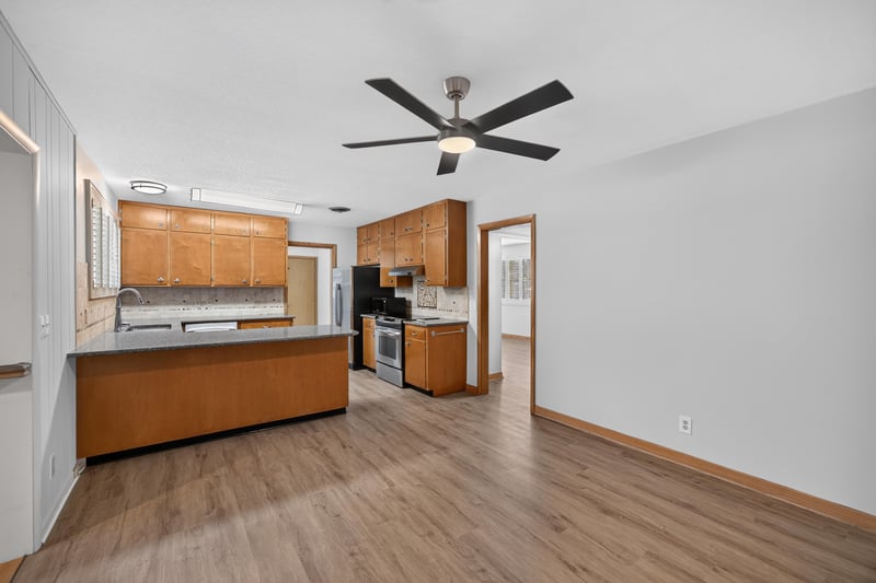 Kitchen view with cabinets and range at 1834 Memory Ln, Jacksonville, FL