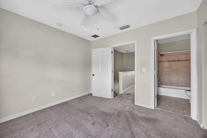 Bedroom with hallway closet and bathroom doors at 342 E Ashley St, Jacksonville, FL 32202