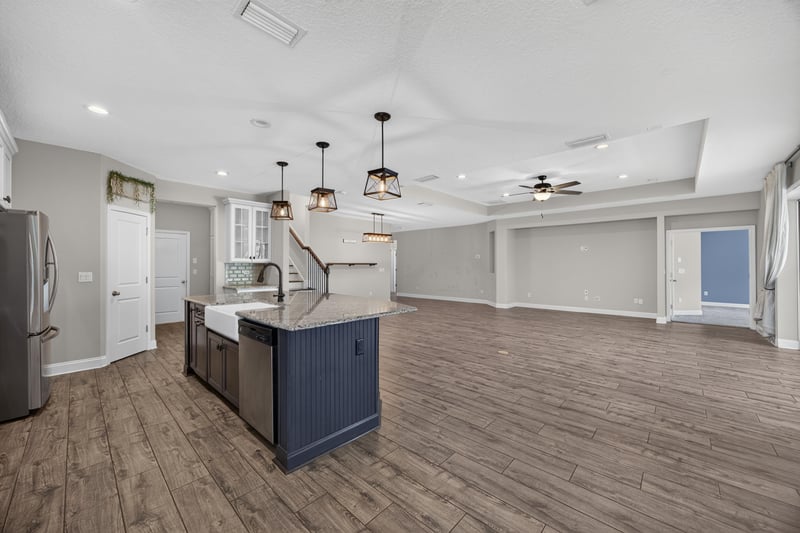 Kitchen island with sink and pendant lighting at 53 Lumen Ct, St. Augustine, FL 32095