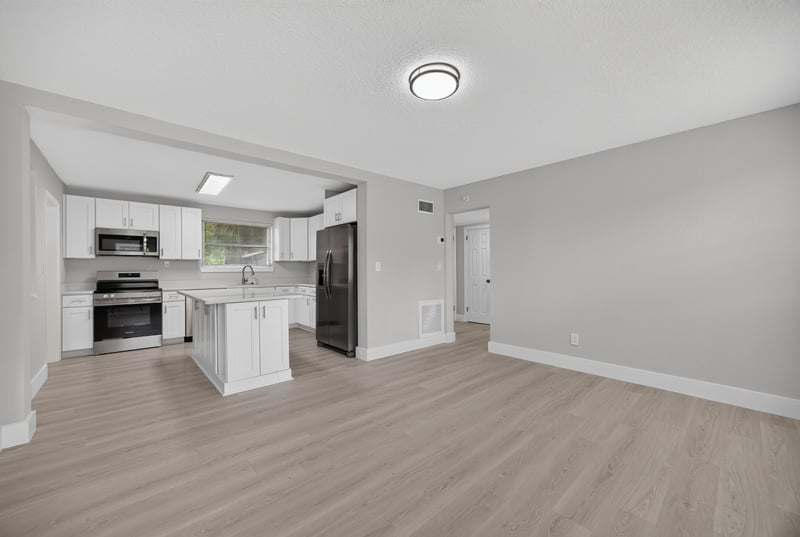 Kitchen and dining area with island at 6238 Randia Dr, Jacksonville, FL 32210