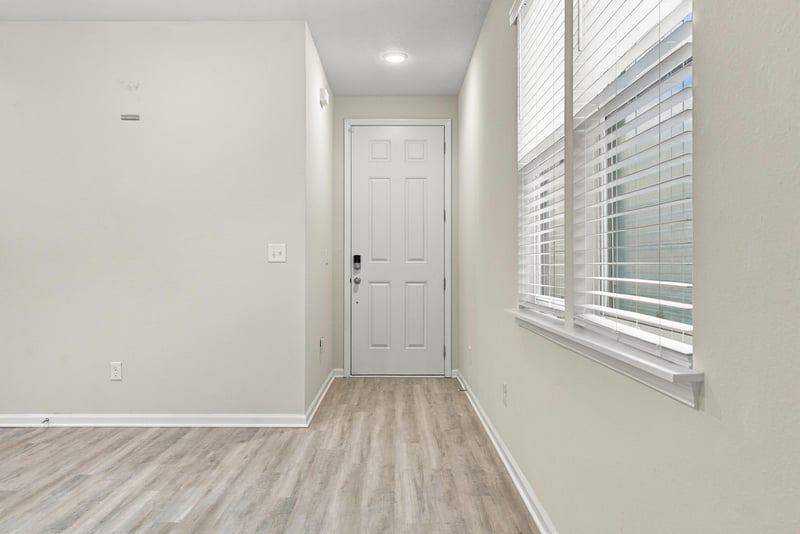 Entry hallway with window and interior door at 7088 Mahogany Run Dr, Jacksonville, FL 32244