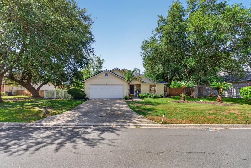Front exterior and driveway in daylight at 8680 Bandera Cir S, Jacksonville, FL 32244