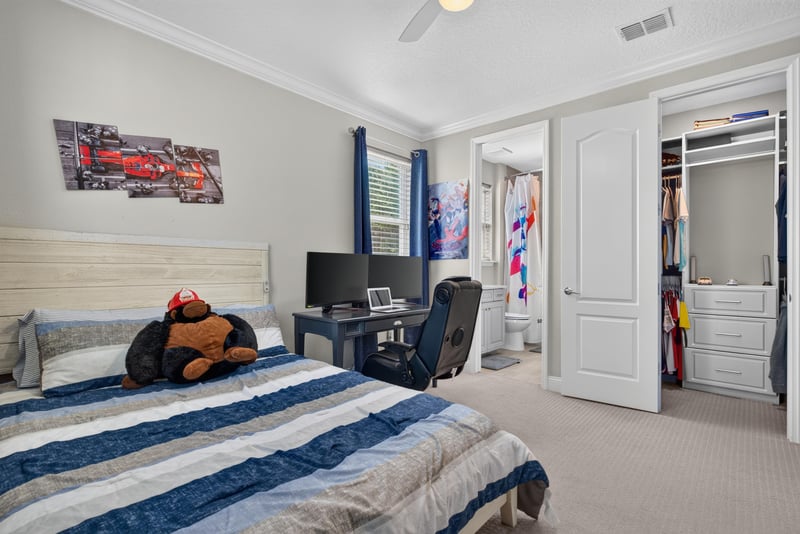 Bedroom with desk and bed at 22 Azura Point